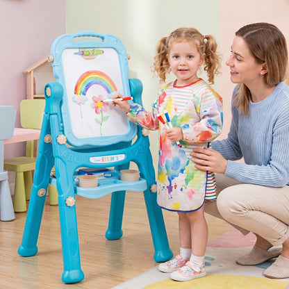 A mother and daughter drawing a rainbow on the art easel in a playroom