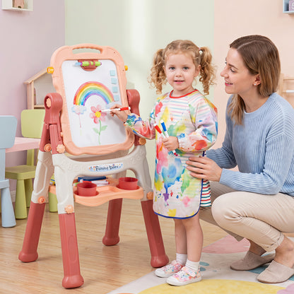 The art easel being used by a young girl drawing on the whiteboard with her mother watching