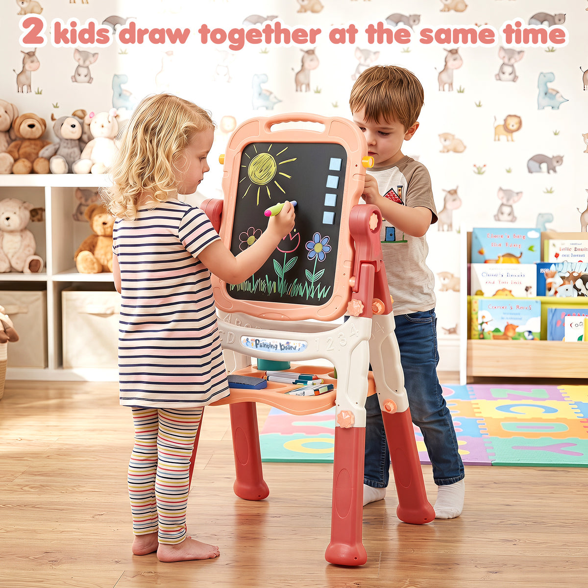 The art easel being used by two children drawing on the chalkboard side at the same time