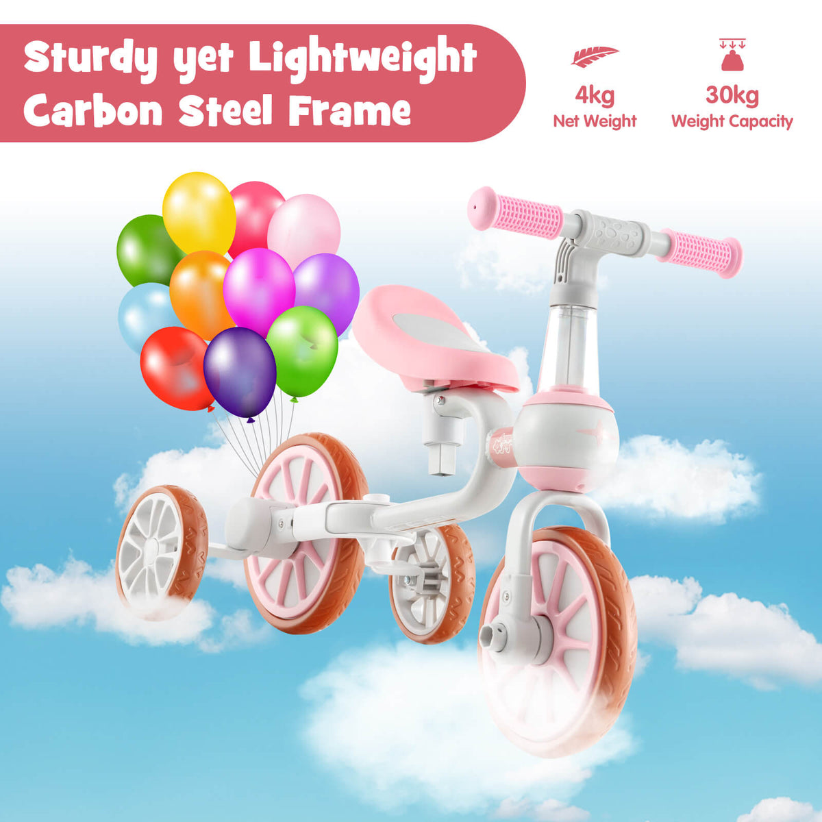 The pink kids trike with a carbon steel frame shown against a cloudy sky with balloons