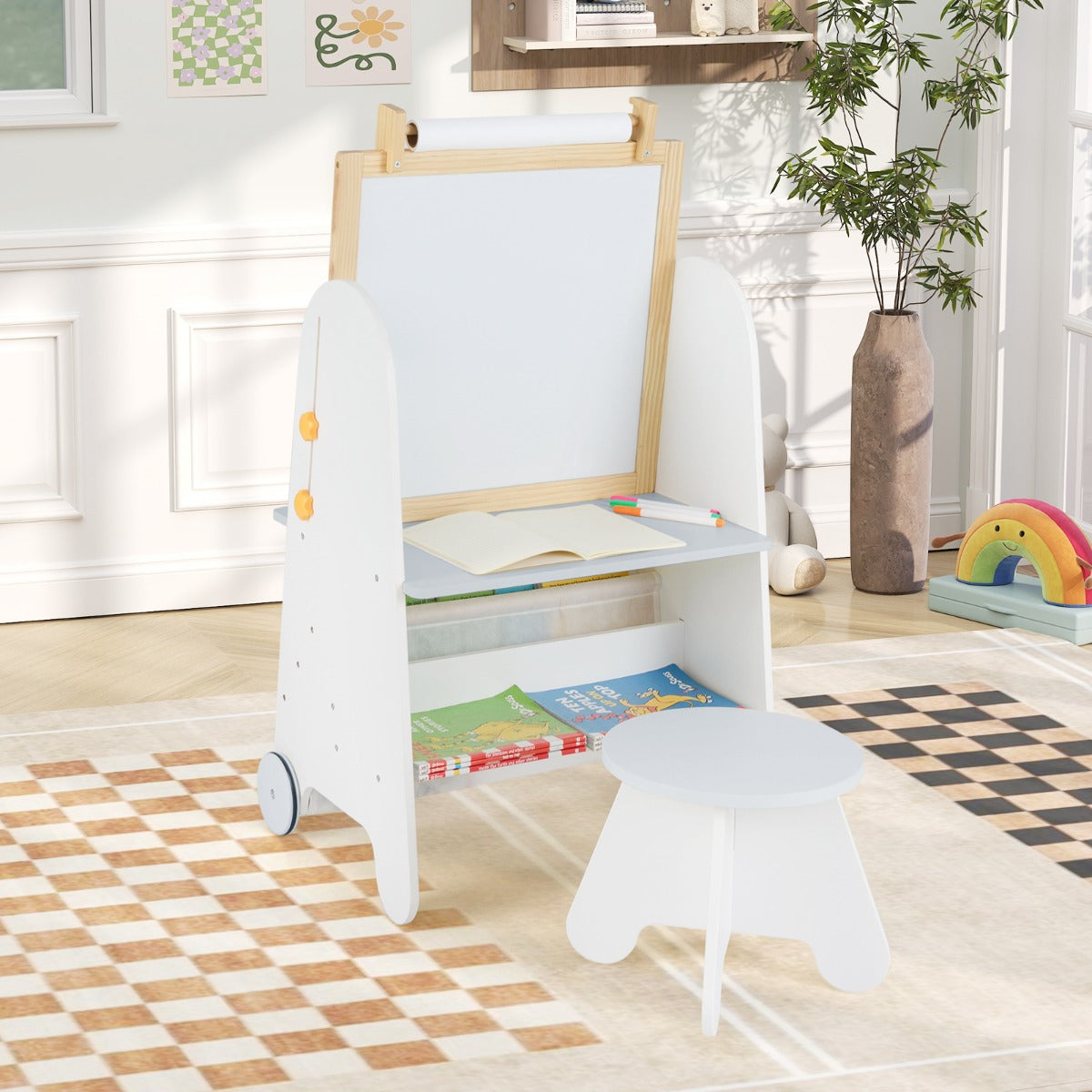 the wooden activity table with a whiteboard and storage shelves standing on a rug