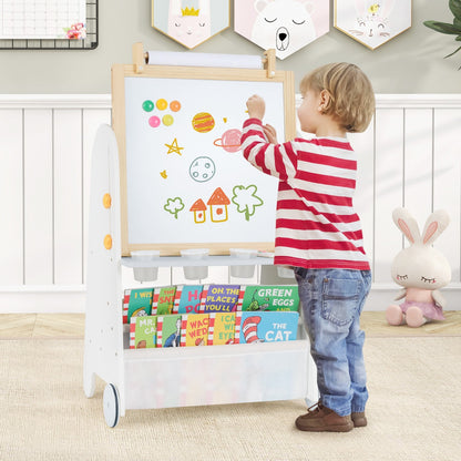 the art easel being used by a young child to draw colourful shapes on the magnetic whiteboard