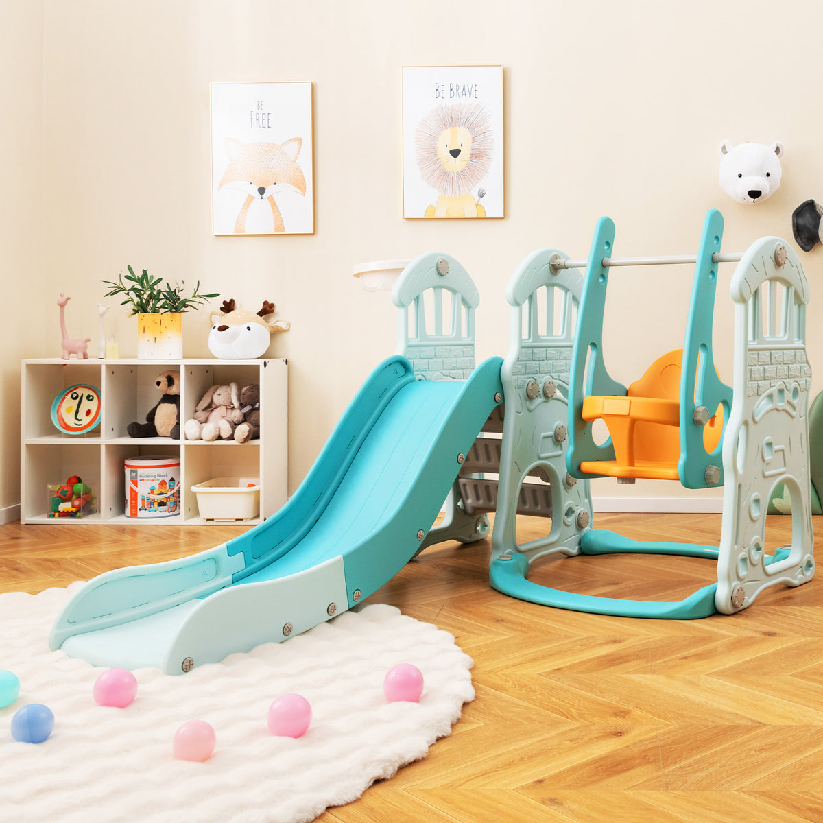 The kids slides unit placed on a rug in a nursery with toys and wall art