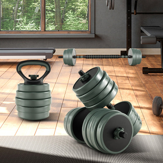 The dumbbells and a kettlebell placed on a wooden floor in a home gym setting