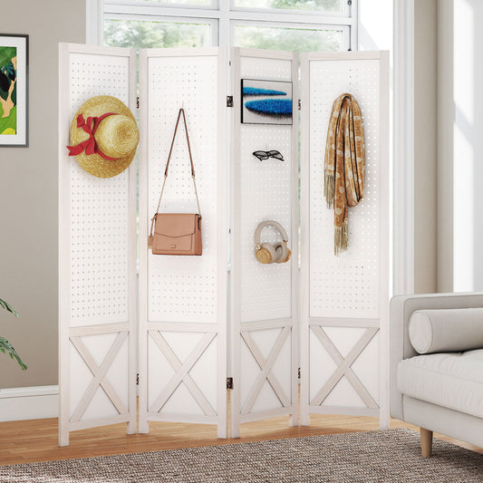The room divider placed in a living room with accessories hanging on the pegboard panels