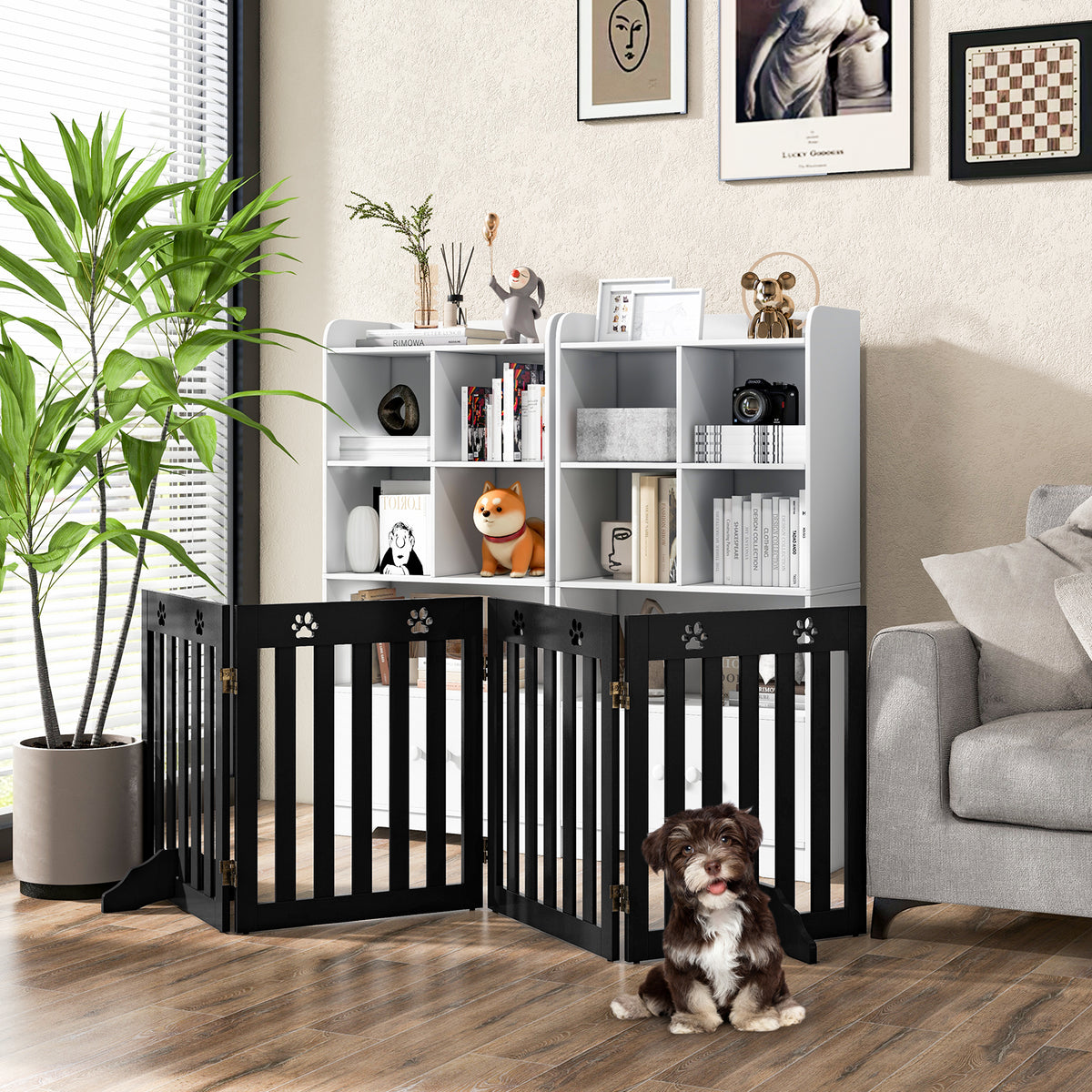 The pet gate is set up in a living room with two dogs nearby