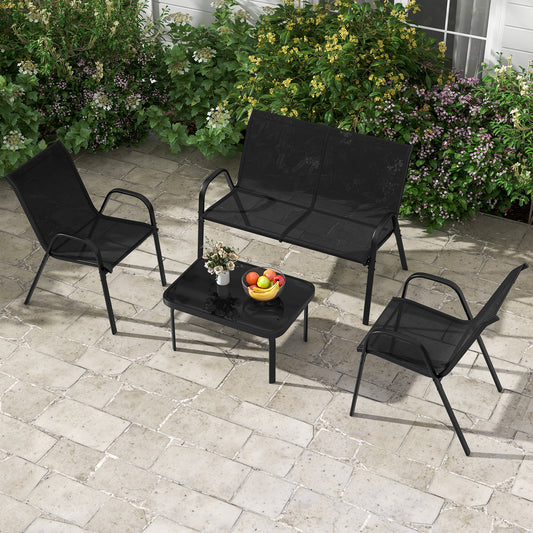Black patio furniture set with chairs and coffee table on a paved patio