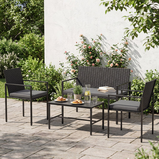 The grey outdoor furniture set including two chairs and a loveseat with a coffee table