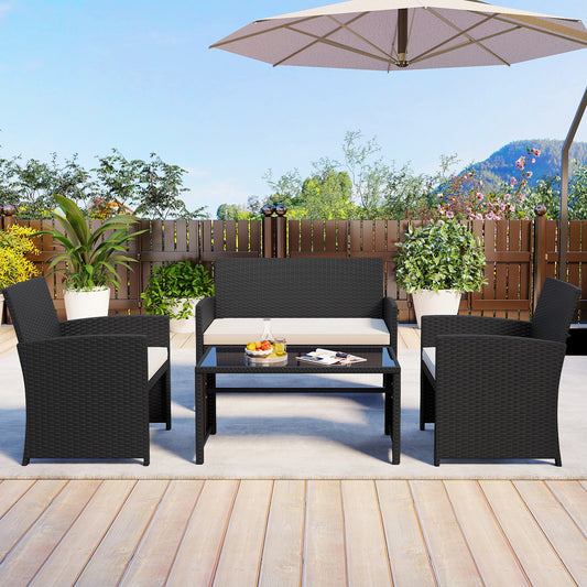 The patio furniture set arranged on a paved patio area with plants and a fence in the background