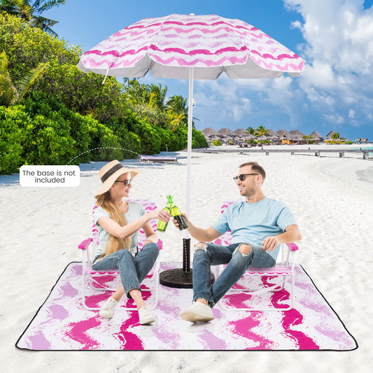 Couple relaxing on the beach with the camping furniture set