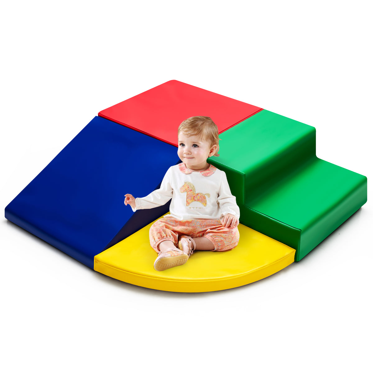 Baby sitting on the red foam climbing block of the play set