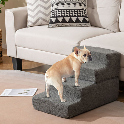 French bulldog standing on the grey foam dog steps beside a sofa