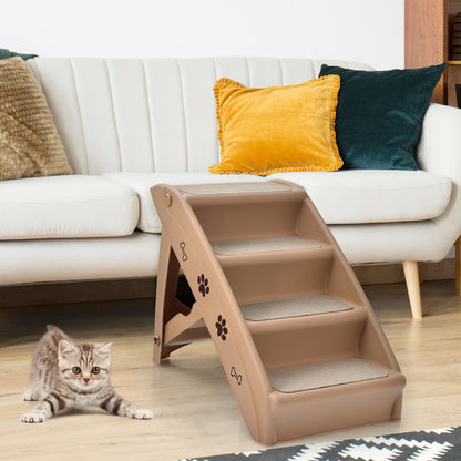 A four-step pet stair unit is placed next to a sofa, with a kitten looking at it