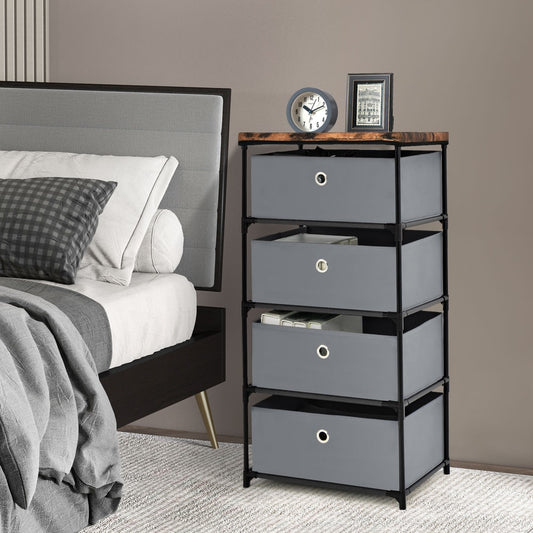 Grey fabric dresser with drawers and metal frame next to a bed in a bedroom setting