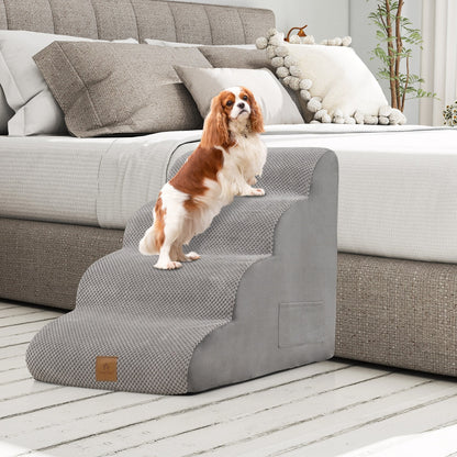 The grey pet steps positioned beside a bed with a small dog standing on the top tier