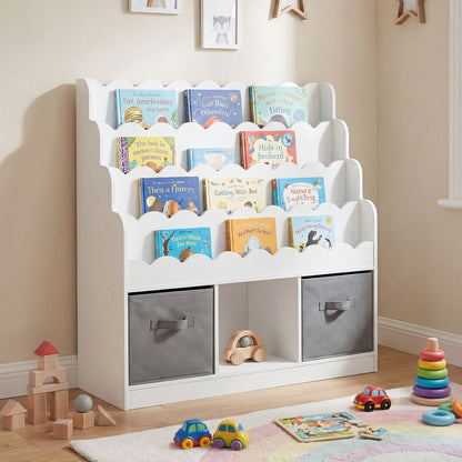 The white kids storage unit filled with colourful children's books and two grey fabric drawers
