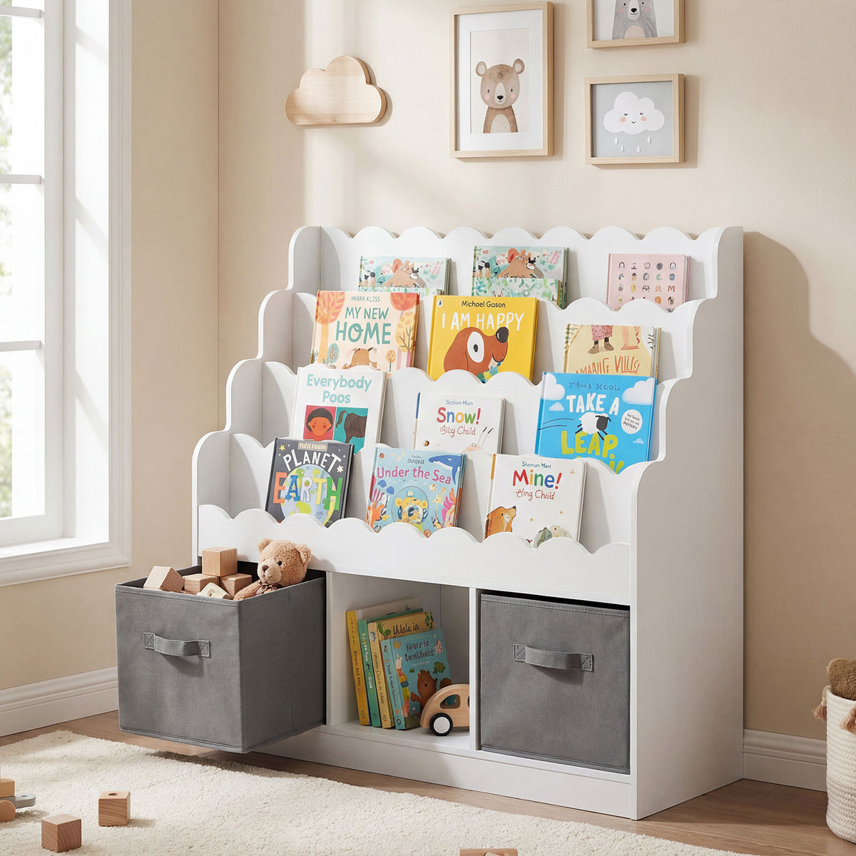 The white kids storage unit in a nursery setting with books and toys in the drawers