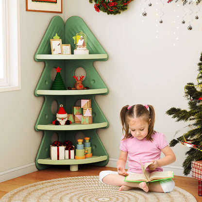 A young girl reads a book next to the green corner bookshelf in a playroom