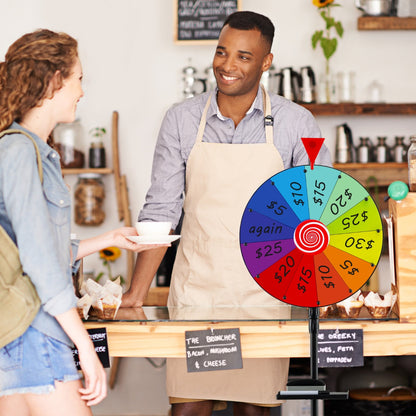 The prize wheel placed on a counter in a cafe while a customer interacts with staff