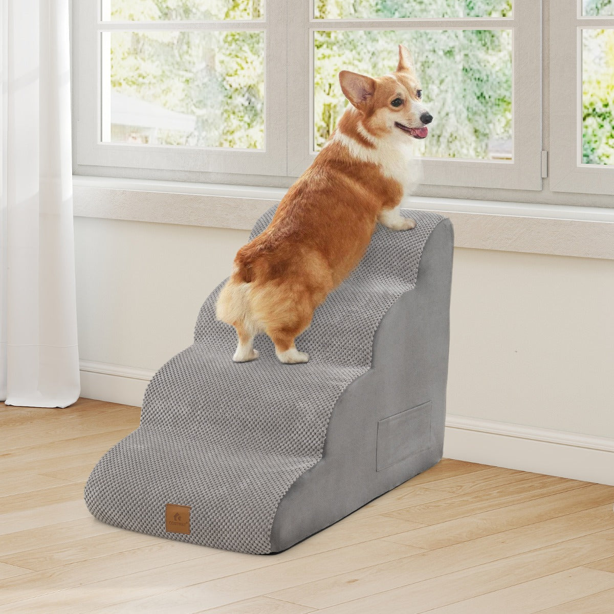 4-Tier Foam Dog Ramp, the dog steps with a dog on top next to a window