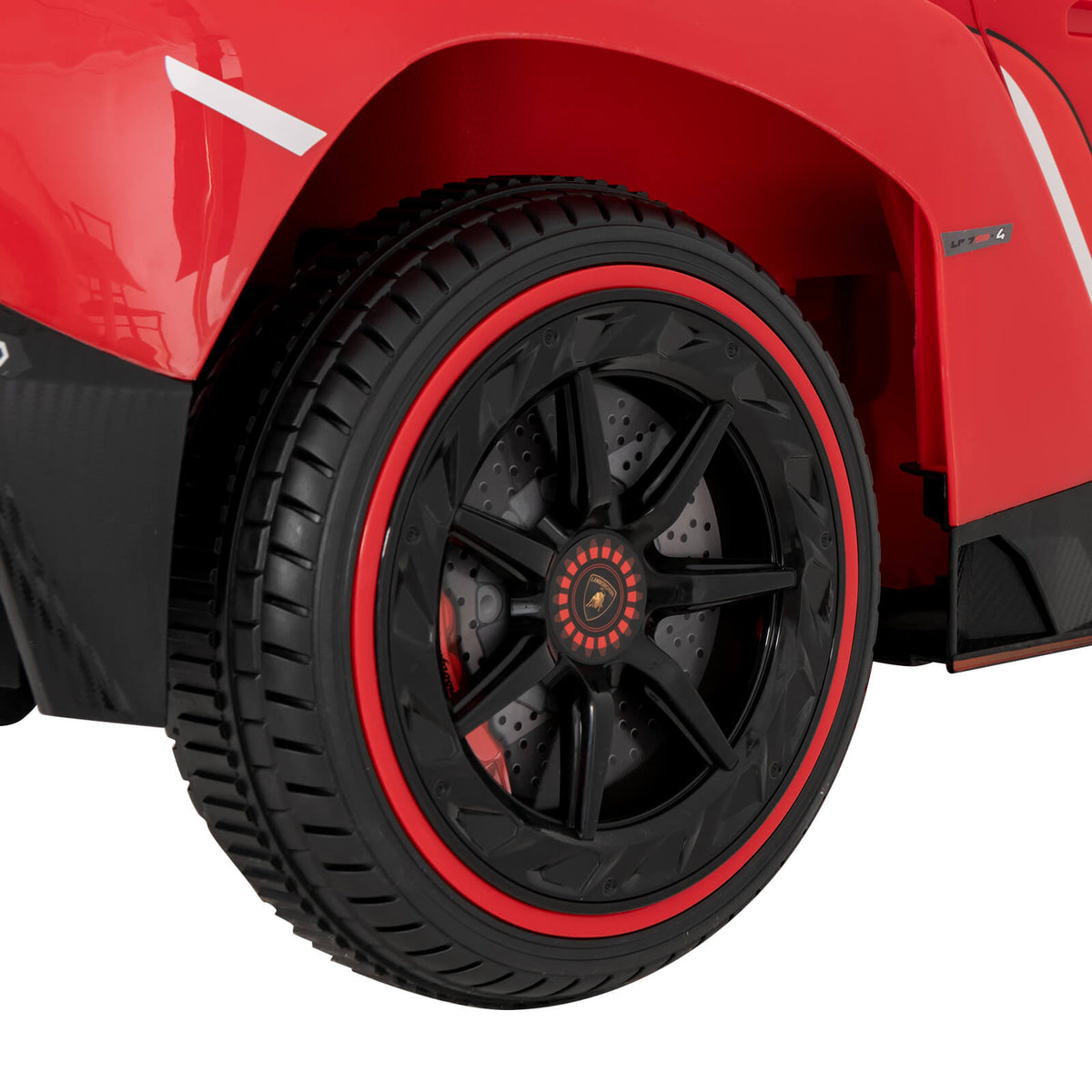 Close-up of the wheel and tyre on the red kids electric sports car