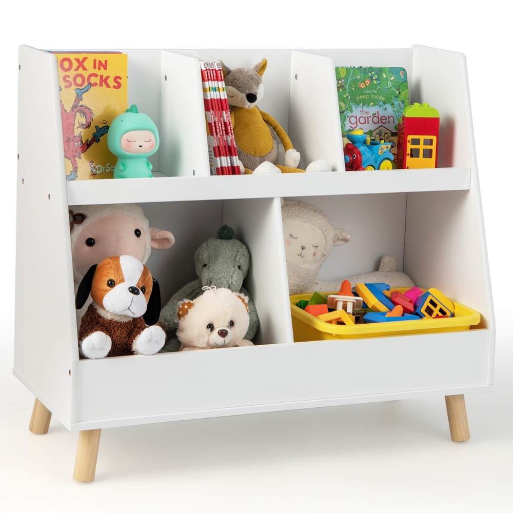 Close up of the white kids storage unit showing its compartments and wooden legs