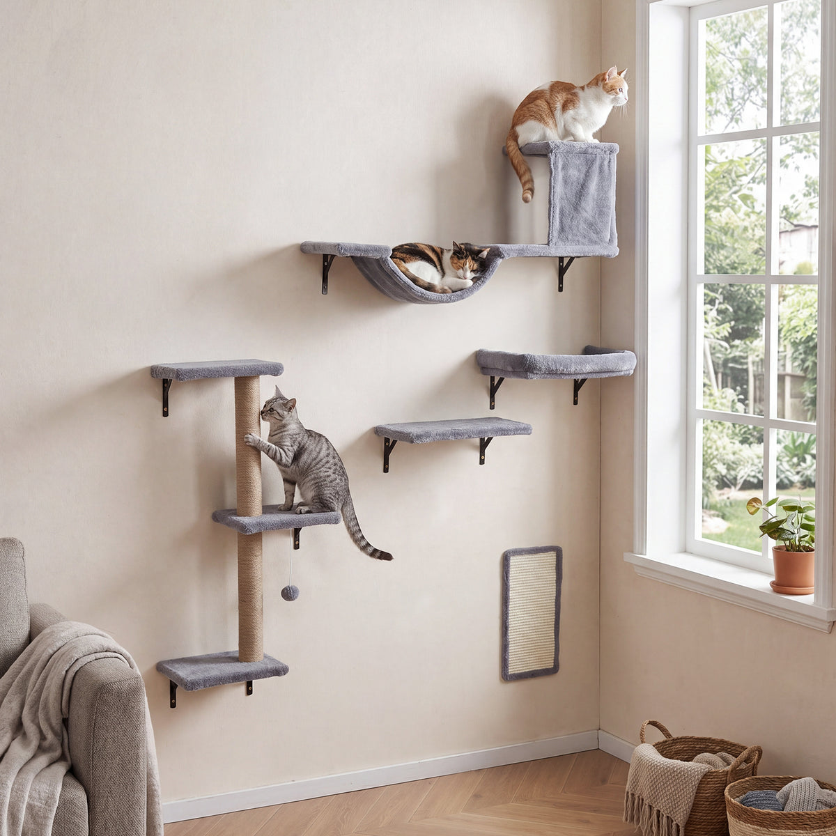 The cat furniture set arranged on a wall with three cats climbing and lounging on the shelves