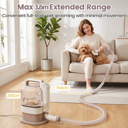 Woman grooming a small dog with the pet grooming vacuum kit showing the extended hose range
