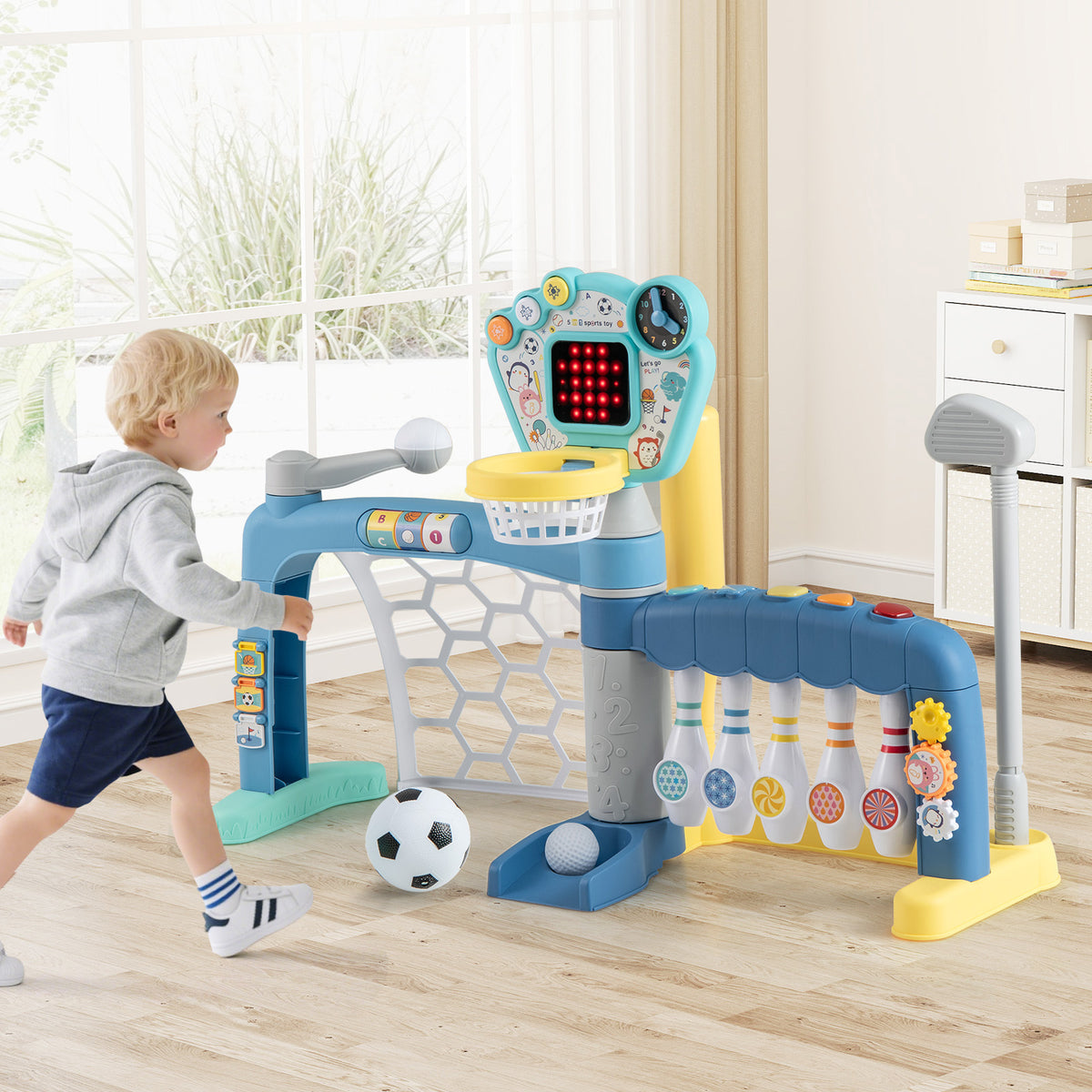 Kids activity center with a child kicking a soccer ball into the goal