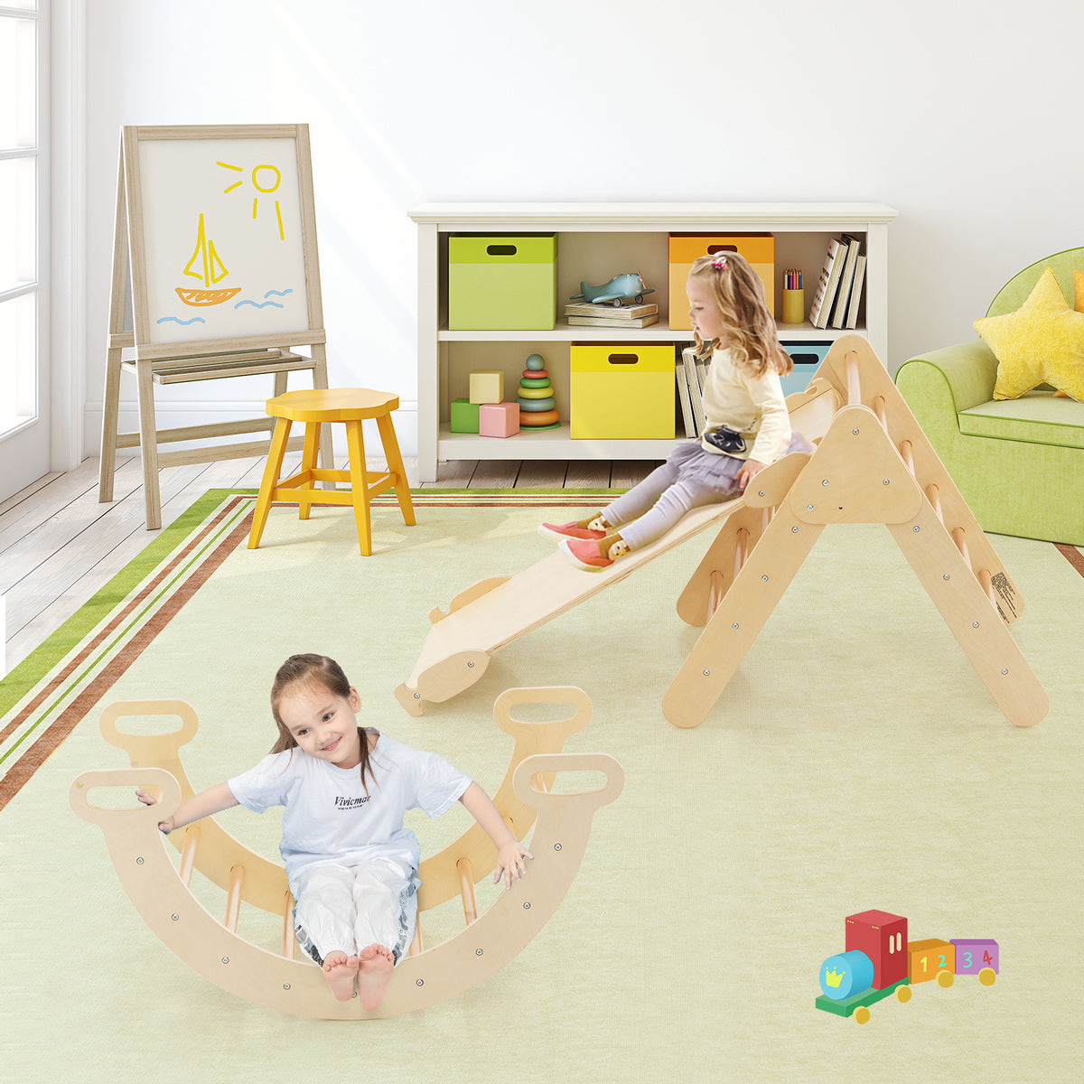 Kids climbing frame with slide and rocker in a nursery room