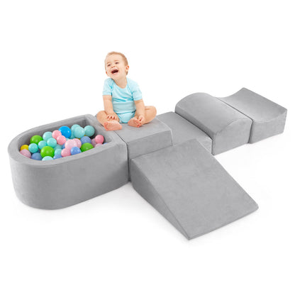 5-Piece Climb and Crawl Playset with a ball pit and a happy baby sitting on the grey foam blocks