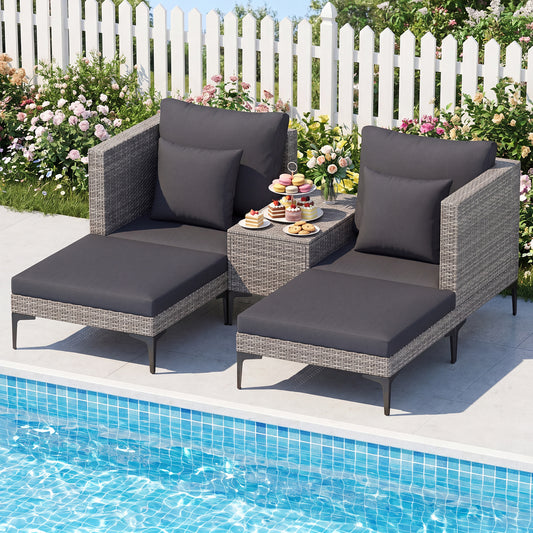 The patio furniture set arranged by a swimming pool with a white fence and flowers in the background