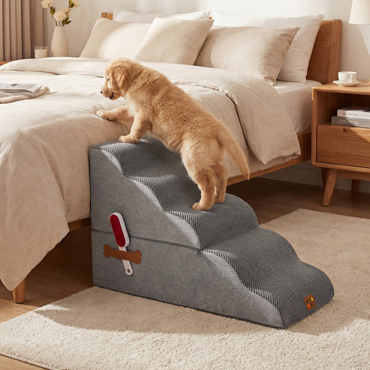 the pet ramp placed next to a bed with a puppy climbing up to reach the mattress