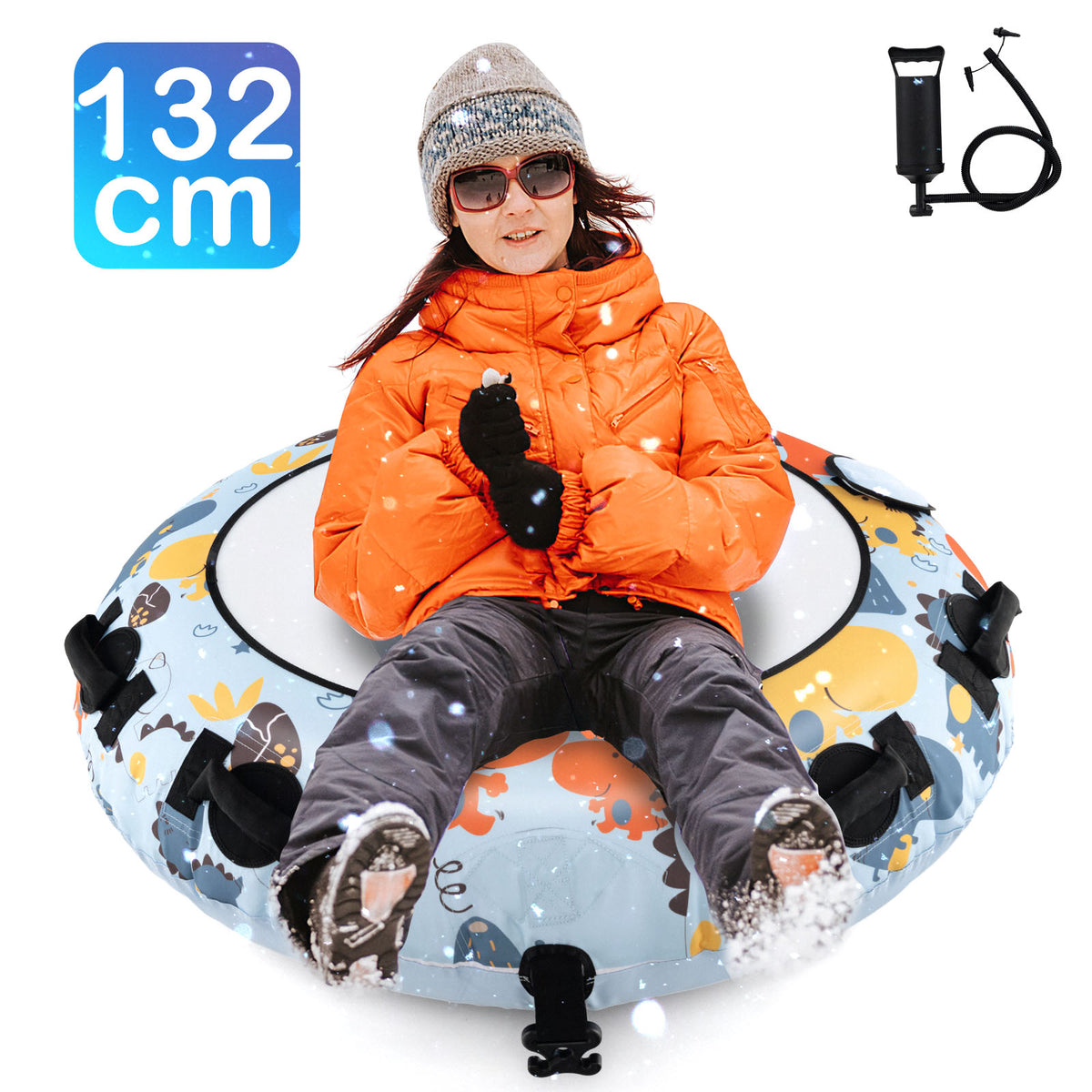 Woman in orange jacket and sunglasses on the blue dinosaur snow tube sliding down a snowy hill