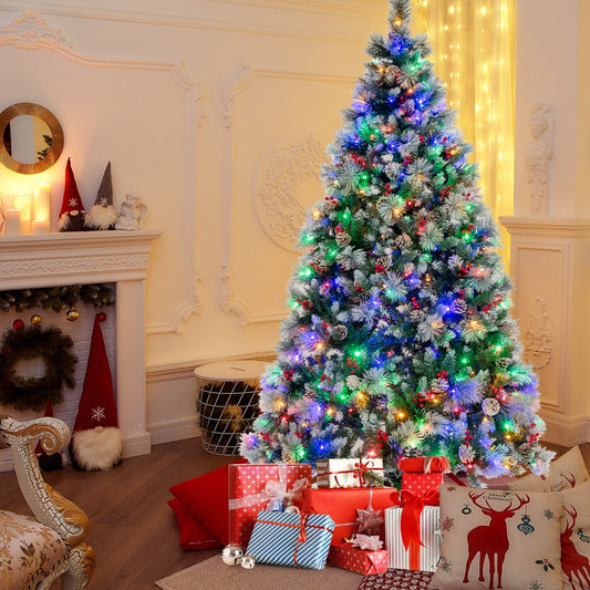 The Christmas tree decorated with multi-coloured lights in a festive living room with gifts