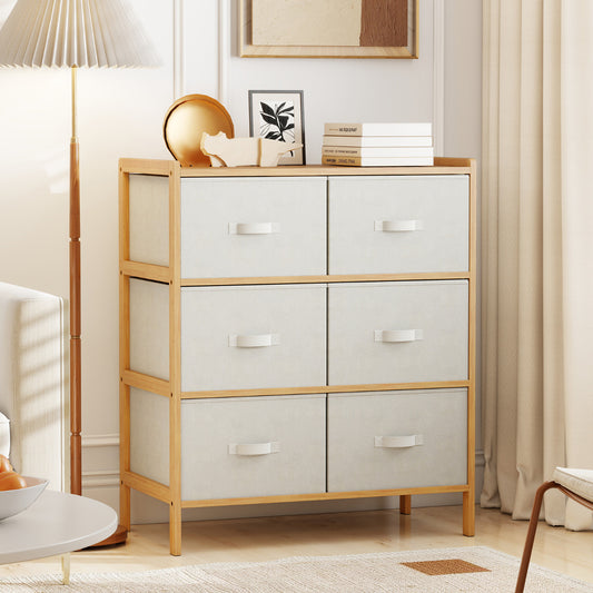 The wooden dresser sits in a bright living room next to a tall floor lamp and home decor