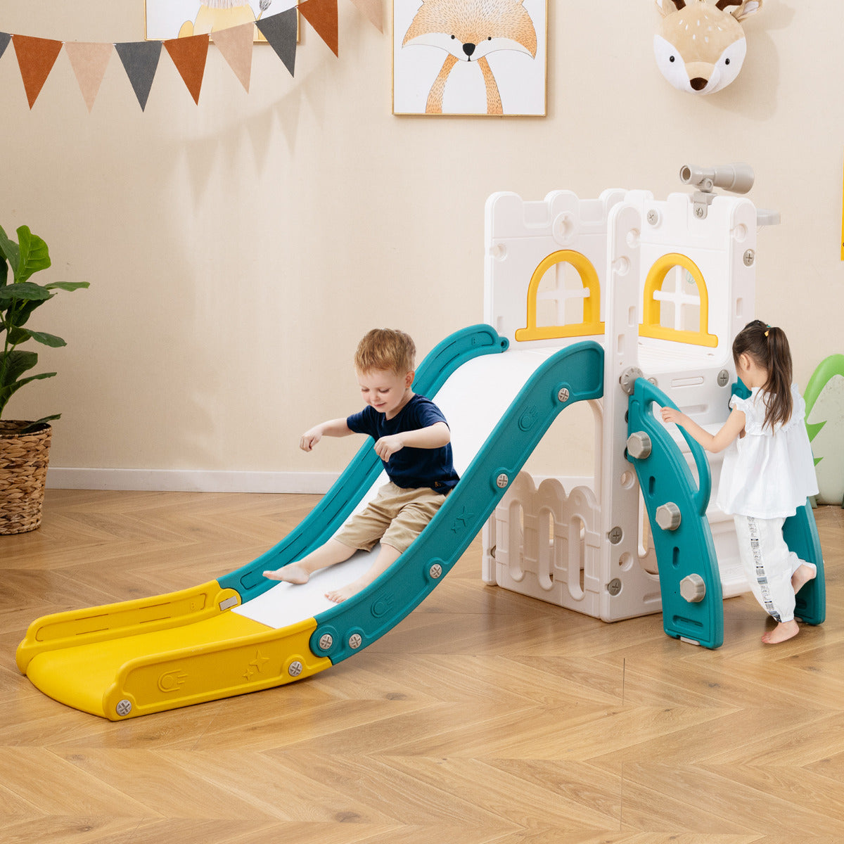 Children playing on the L-shaped toddler slide indoors