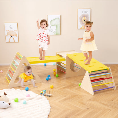 Children playing on a wooden climbing frame with a yellow slide in a bright room