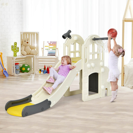 The kids slide in a playroom with one child sliding down and another playing basketball
