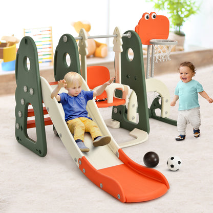 A toddler slides down the orange and green kids slide and swing set