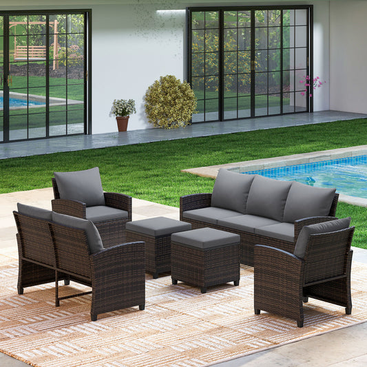 The garden furniture set arranged on a patio rug by a swimming pool