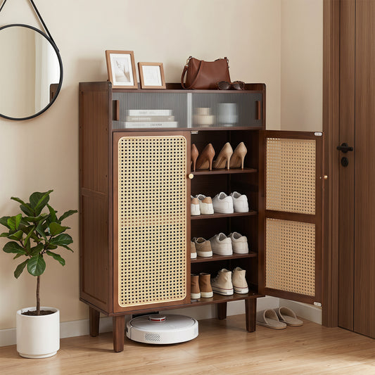 The shoe cabinet placed in a hallway filled with various pairs of shoes and home accessories