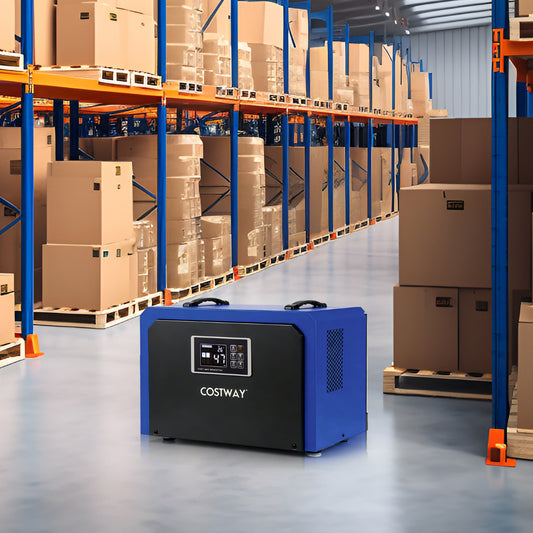 Blue and black dehumidifier in a warehouse setting with shelves of boxes
