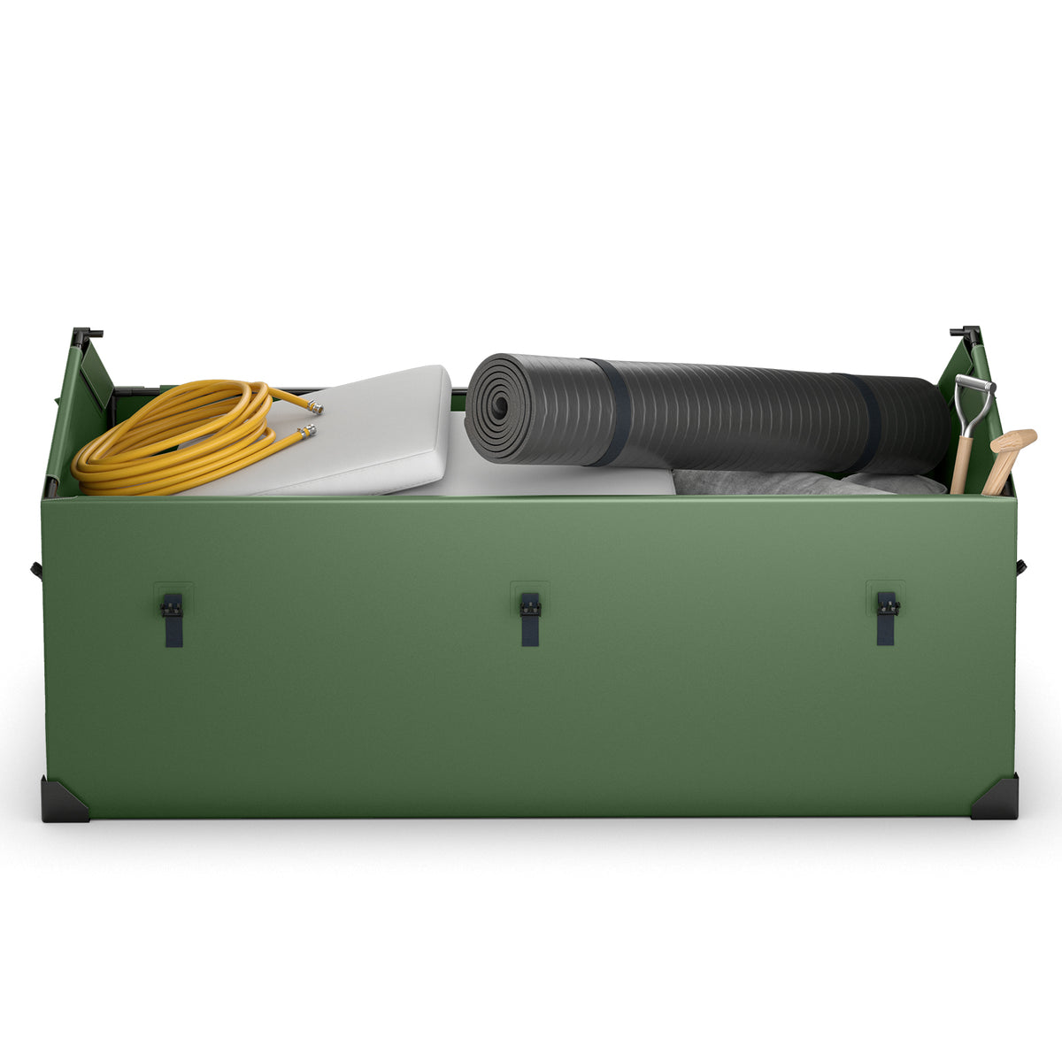Inside the green outdoor storage box, showing a rolled-up mat, a yellow hose, a white cushion and a small shovel