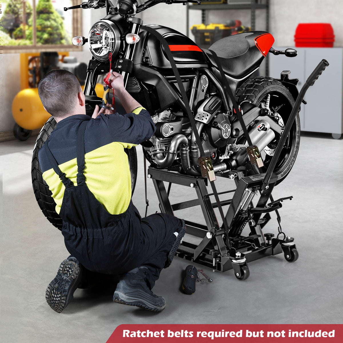 The hydraulic lift is shown in use, holding a motorcycle while a person works on it