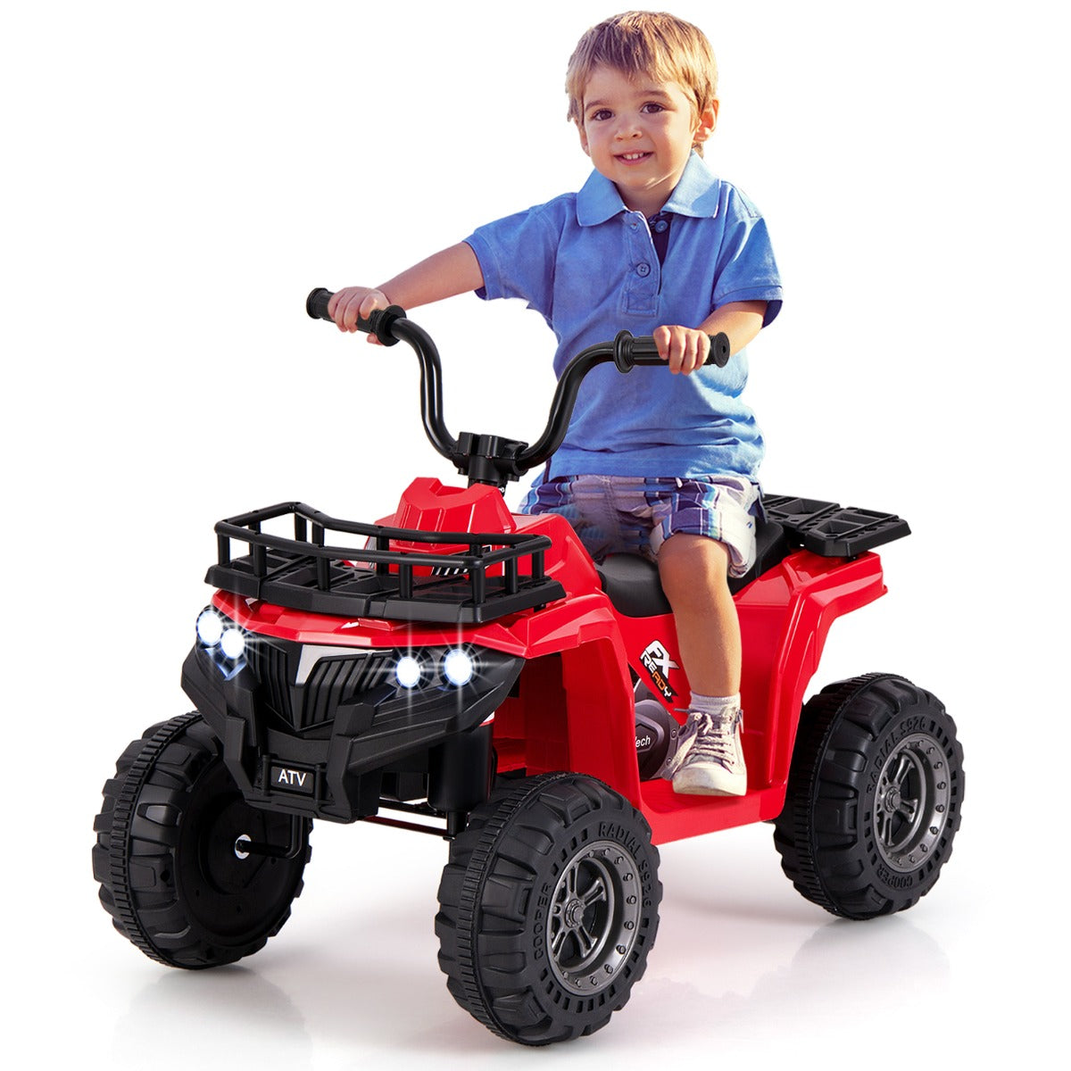 The red kids electric quad with a young boy sitting on the seat holding handlebars