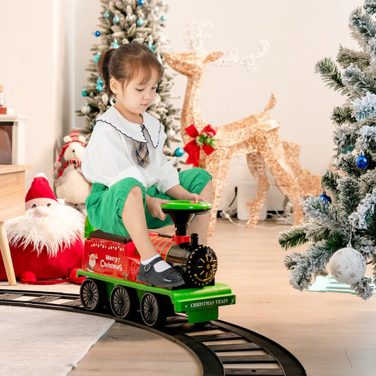 Young girl riding the kids electric train on a track indoors