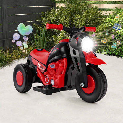 The kids electric motorbike parked outdoors with bubbles floating and musical notes around it
