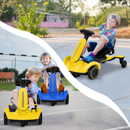Two children riding the kids electric cars in yellow and blue on an outdoor paved playground