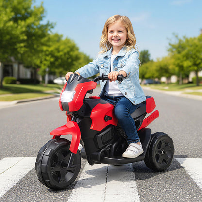 A young girl rides the red kids electric motorbike across a pedestrian crossing